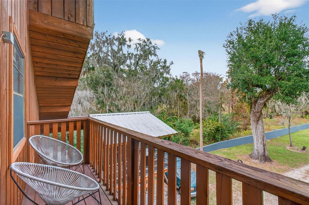 4925 Hamilton Road Lakeland, FL 33811 - Photo 46 of 71 a balcony with table and chairs
