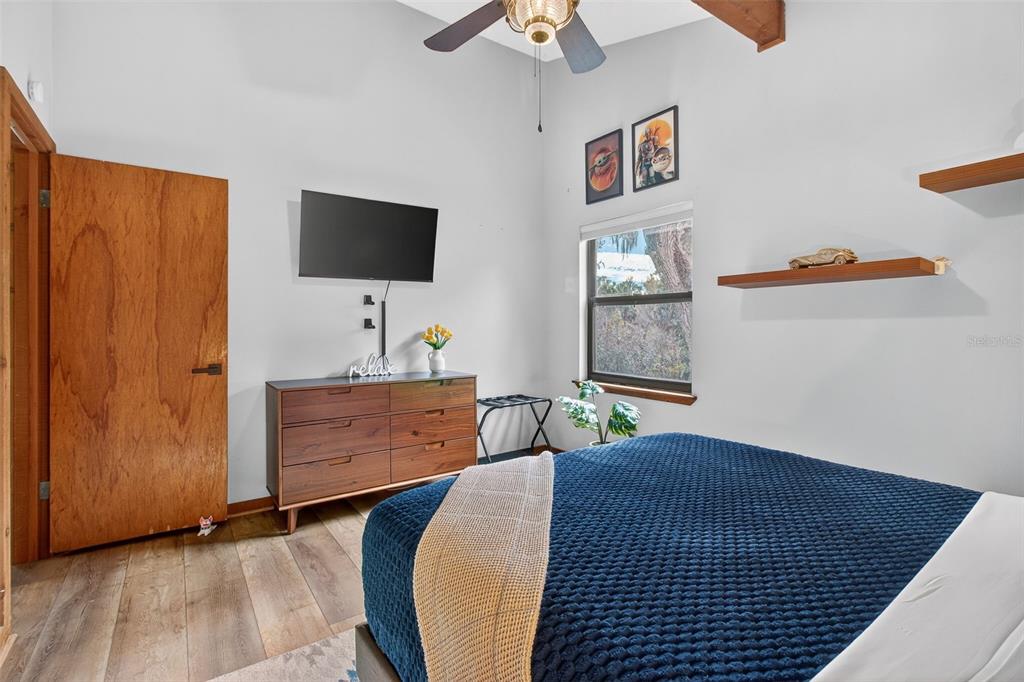 4925 Hamilton Road Lakeland, FL 33811 - Photo 50 of 71 a bedroom with a bed and a flat screen tv