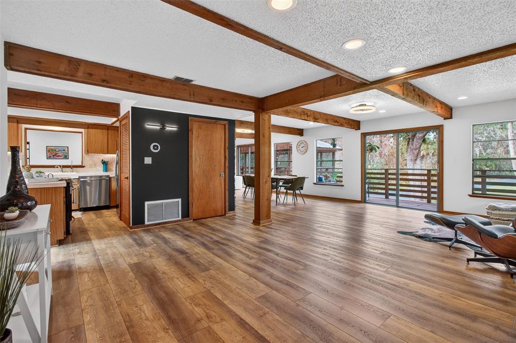 4925 Hamilton Road Lakeland, FL 33811 - Photo 8 of 71 wooden floor in an empty room with a workspace
