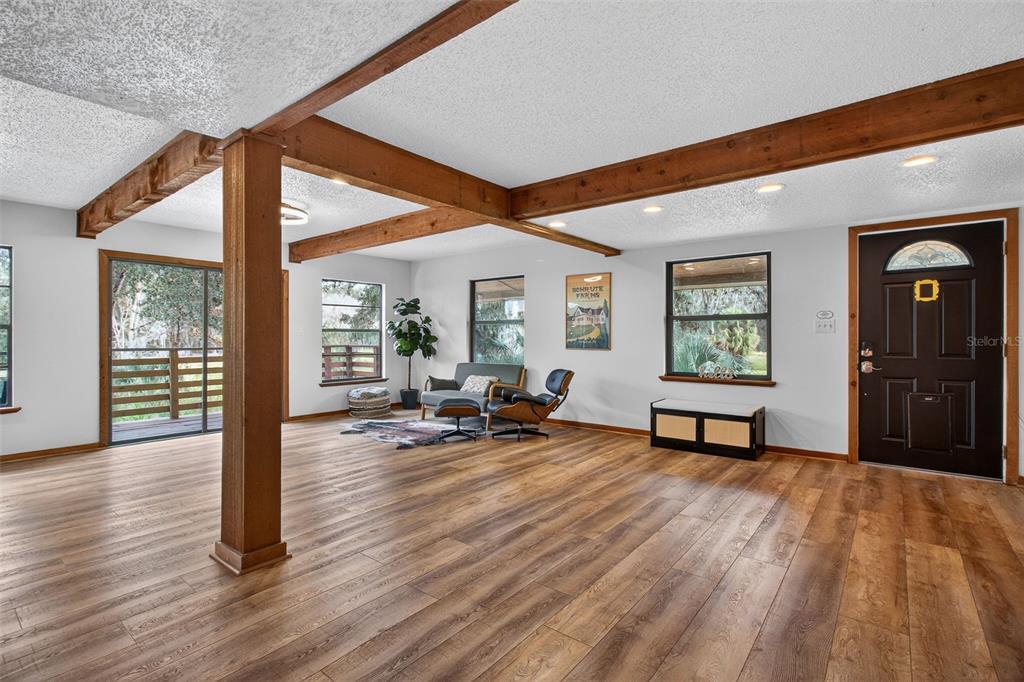 4925 Hamilton Road Lakeland, FL 33811 - Photo 9 of 71 a view of a livingroom with furniture and a floor to ceiling window