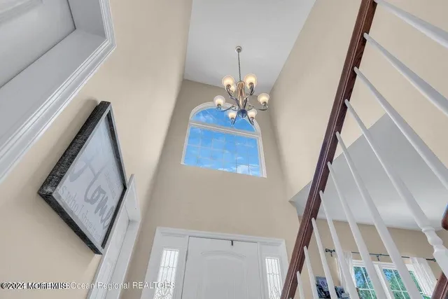 a living room with table and stairs