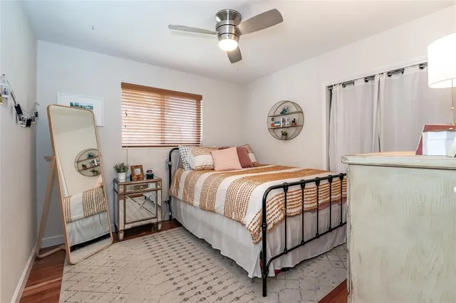 a bedroom with a bed and a table