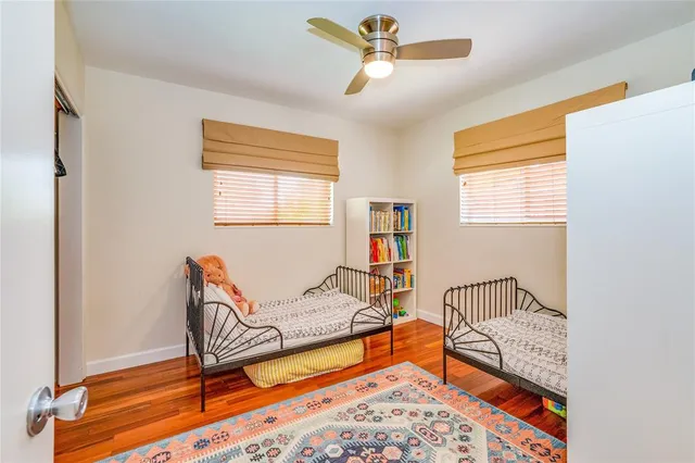 a bedroom with furniture and a window