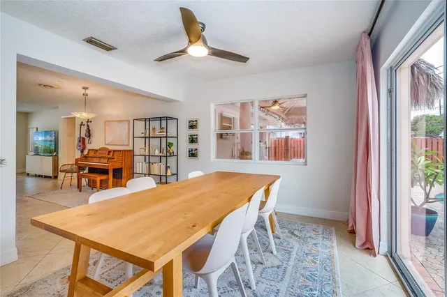 a dining room with furniture and window