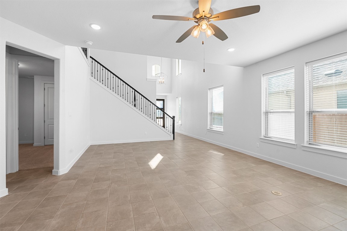 121 Rangel Drive Liberty Hill, TX 78642 - Photo 9 of 23 an empty room with windows and fan