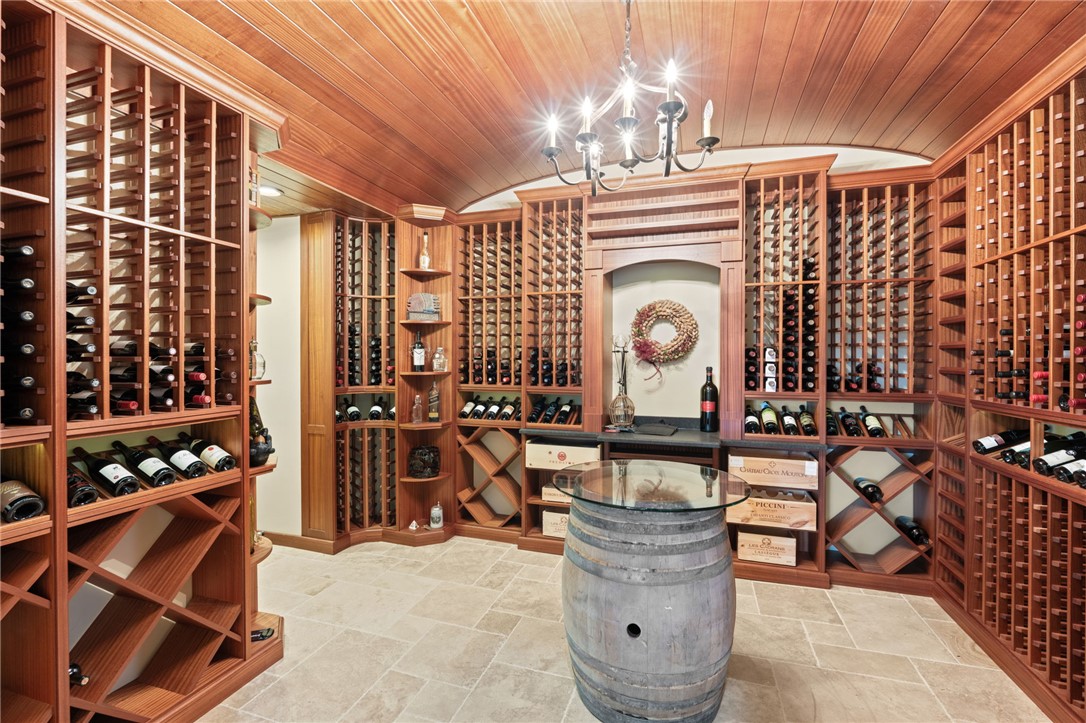 117 Sunrise Ridge Sunset, SC 29685 - Photo 30 of 37 This wine cellar offers extensive storage for a prized collection, featuring custom shelving and rich wood finishes.