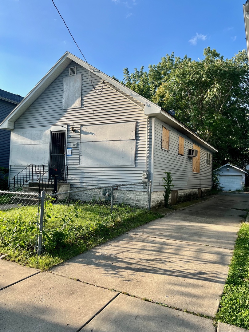 440 Center Avenue Aurora, IL 60505 - Photo 1 of 4 a front view of a house with a yard