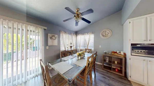 a view of a dining room with furniture window and wooden floor