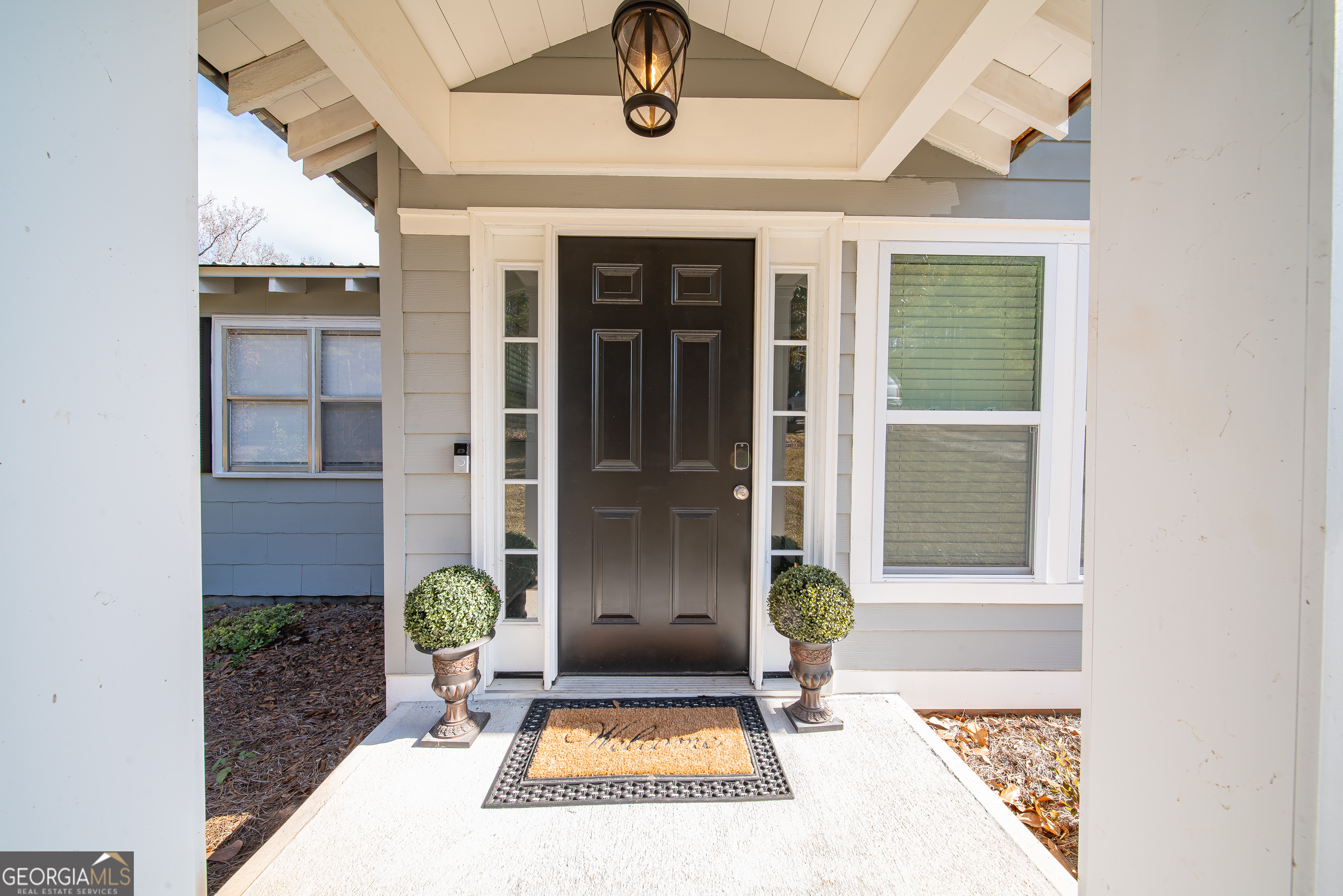 161 Calhoun Road Hamilton, GA 31811 - Photo 18 of 90 a front view of a house with a garden