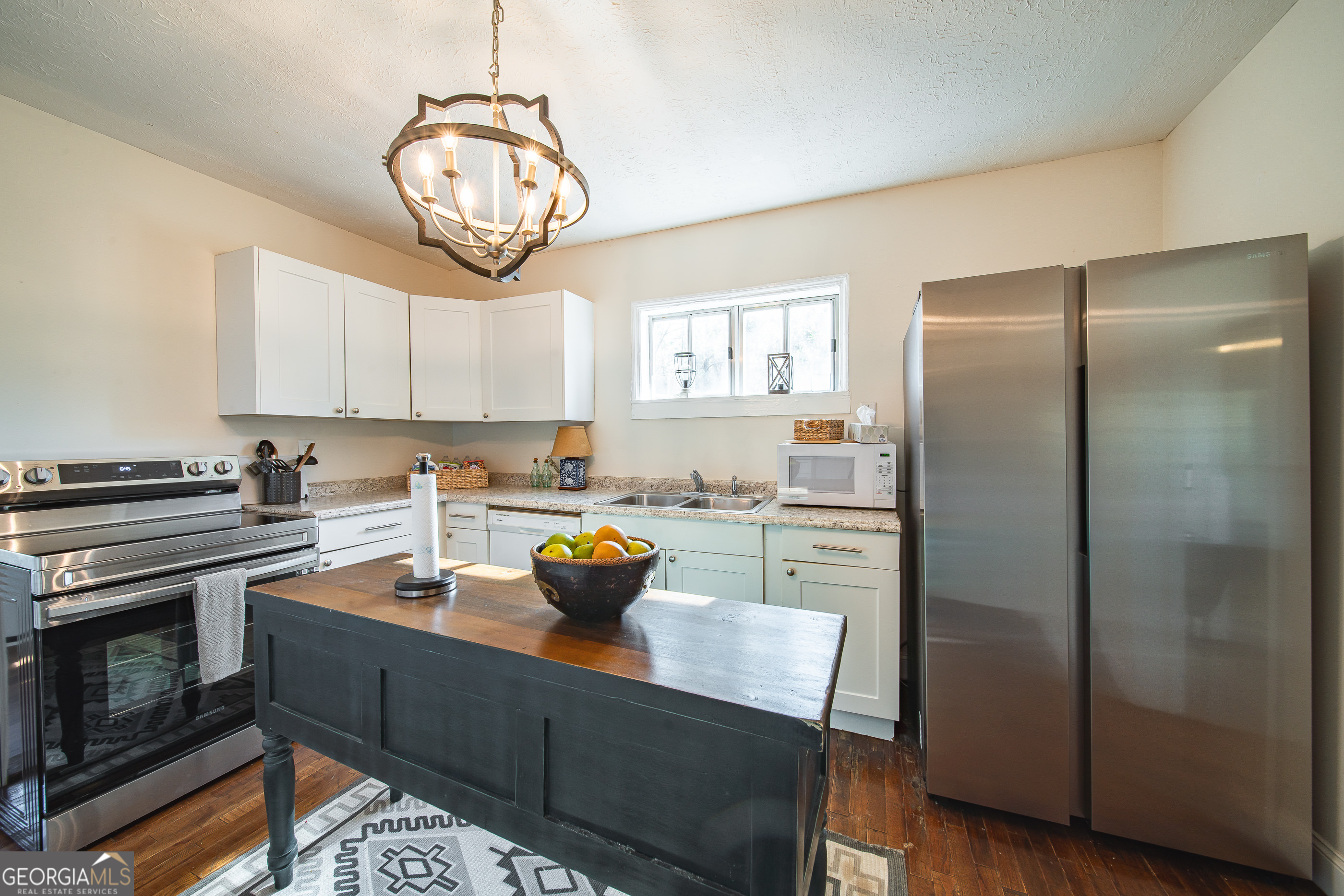 161 Calhoun Road Hamilton, GA 31811 - Photo 2 of 90 a kitchen with a refrigerator and a stove top oven