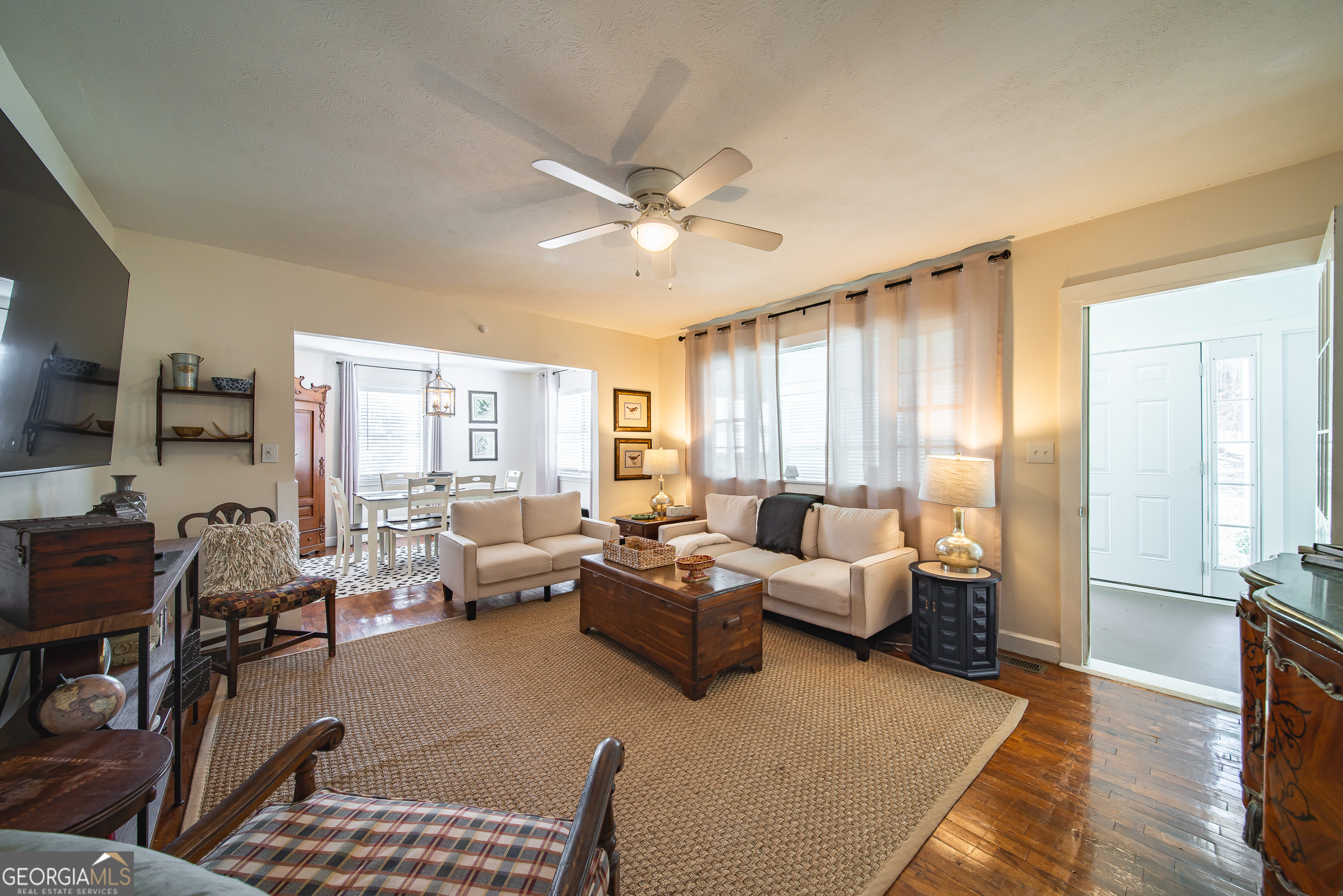 161 Calhoun Road Hamilton, GA 31811 - Photo 22 of 90 a living room with furniture or outdoor view and a large window