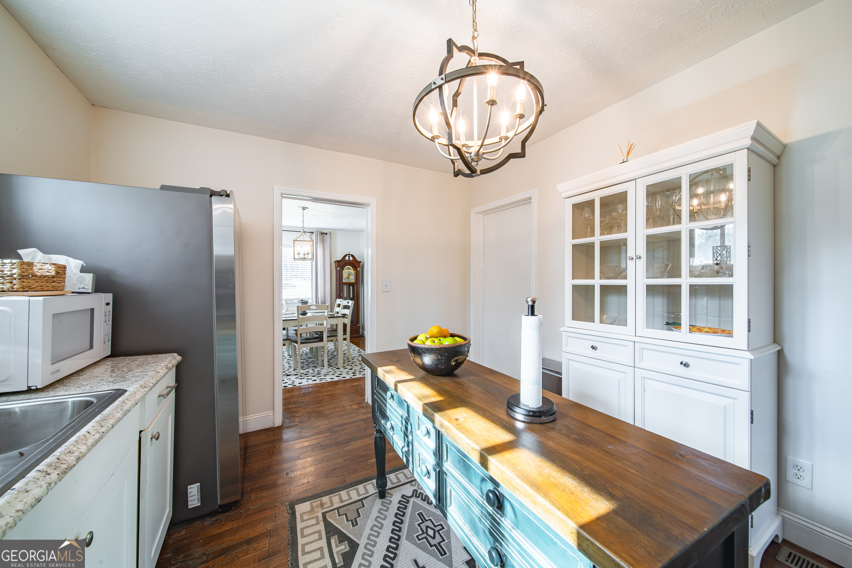 161 Calhoun Road Hamilton, GA 31811 - Photo 27 of 90 a view of a dining room with furniture a chandelier and wooden floor