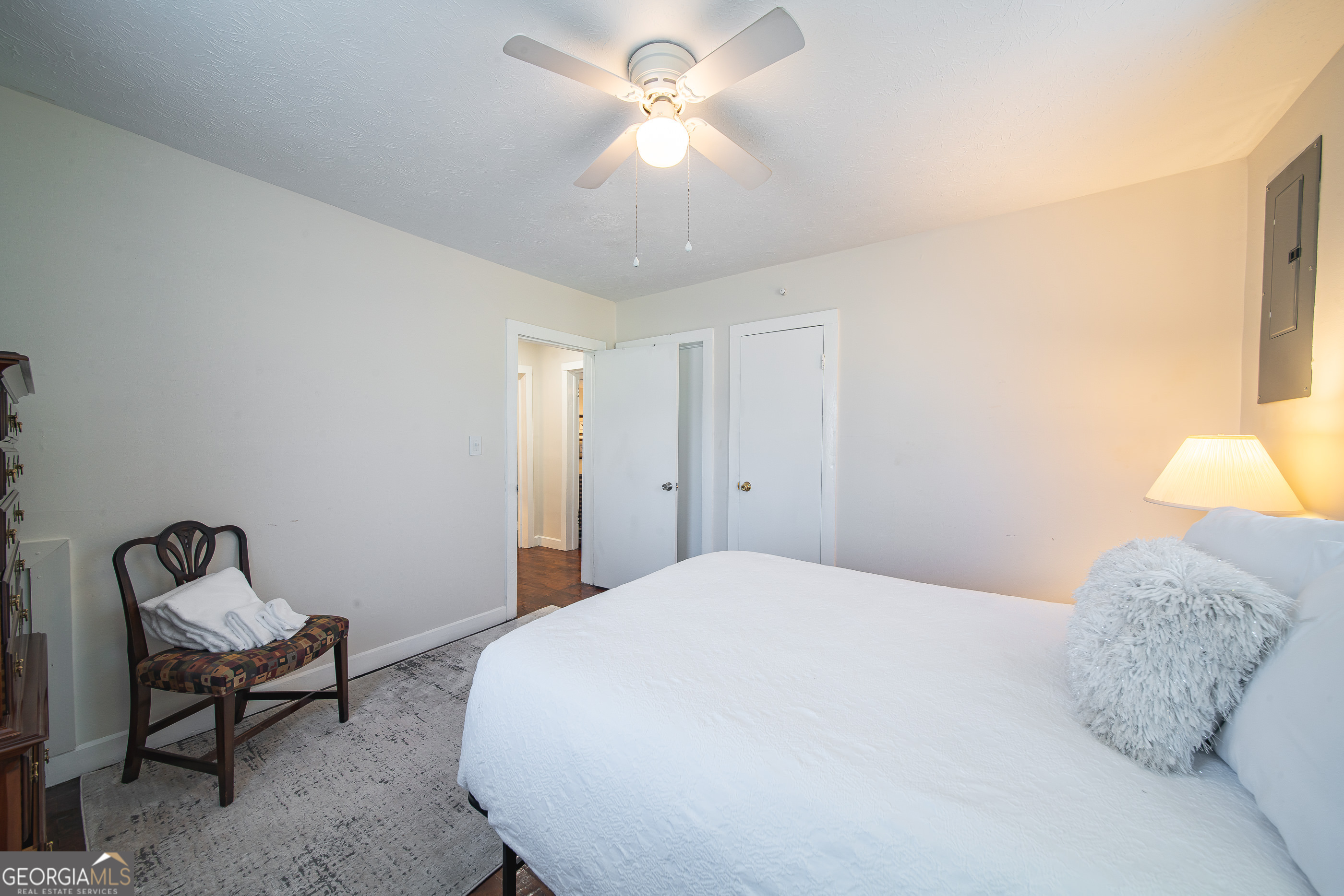 161 Calhoun Road Hamilton, GA 31811 - Photo 34 of 90 a bedroom with a bed and a chandelier