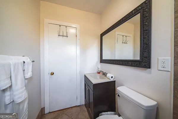 a utility room with a sink washer and dryer