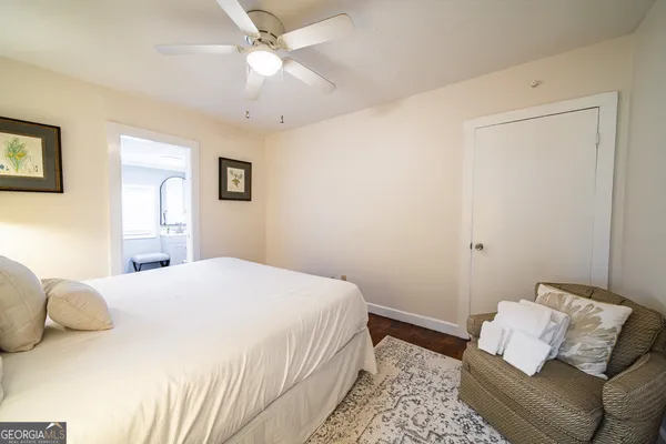 a view of a bedroom with bed and closet