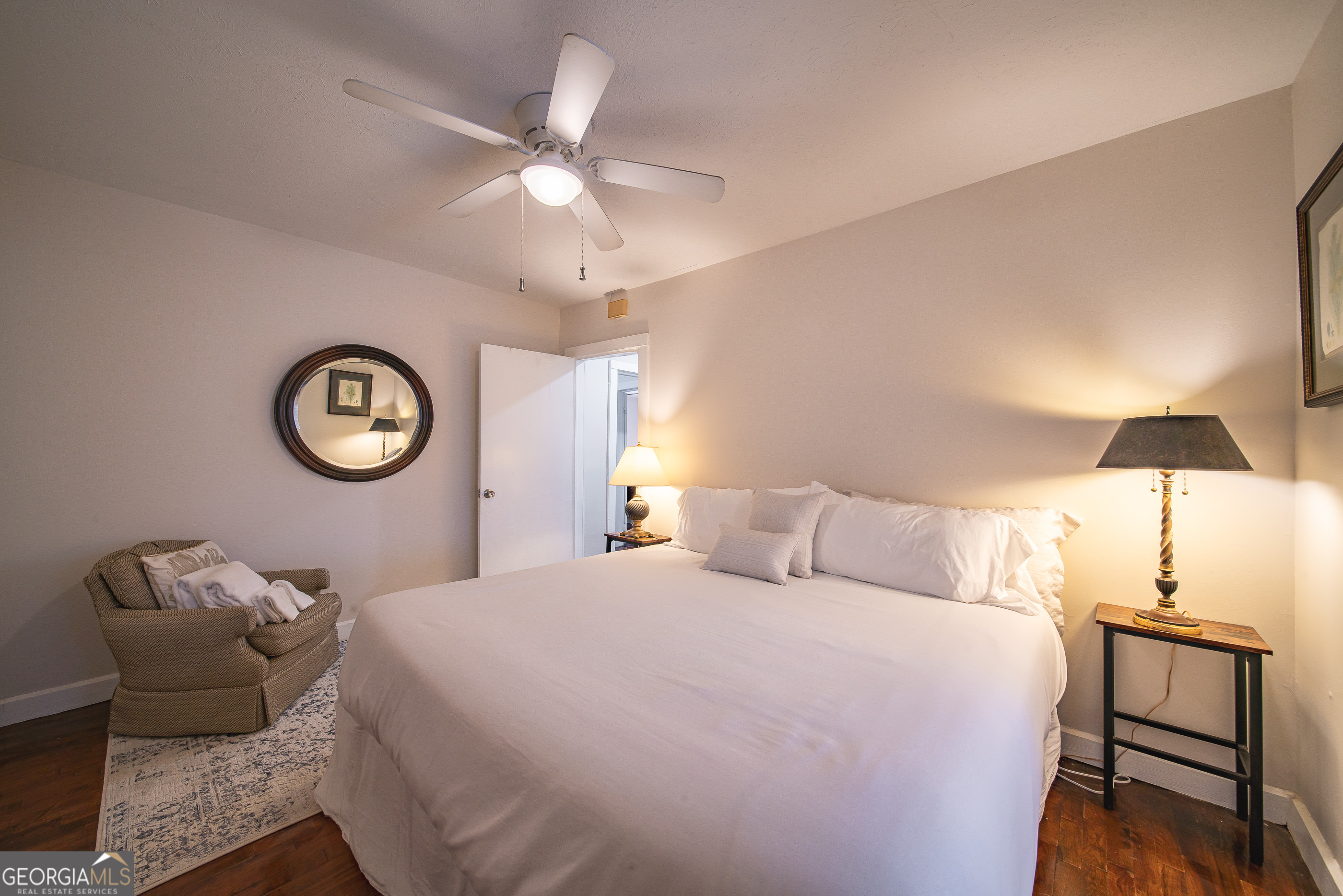 161 Calhoun Road Hamilton, GA 31811 - Photo 39 of 90 a bedroom with a bed and a chandelier