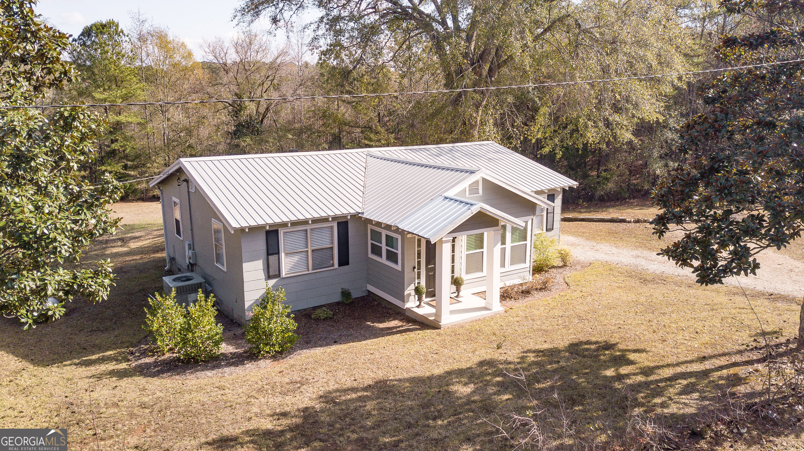 161 Calhoun Road Hamilton, GA 31811 - Photo 55 of 90 a view of a house with a yard covered in snow