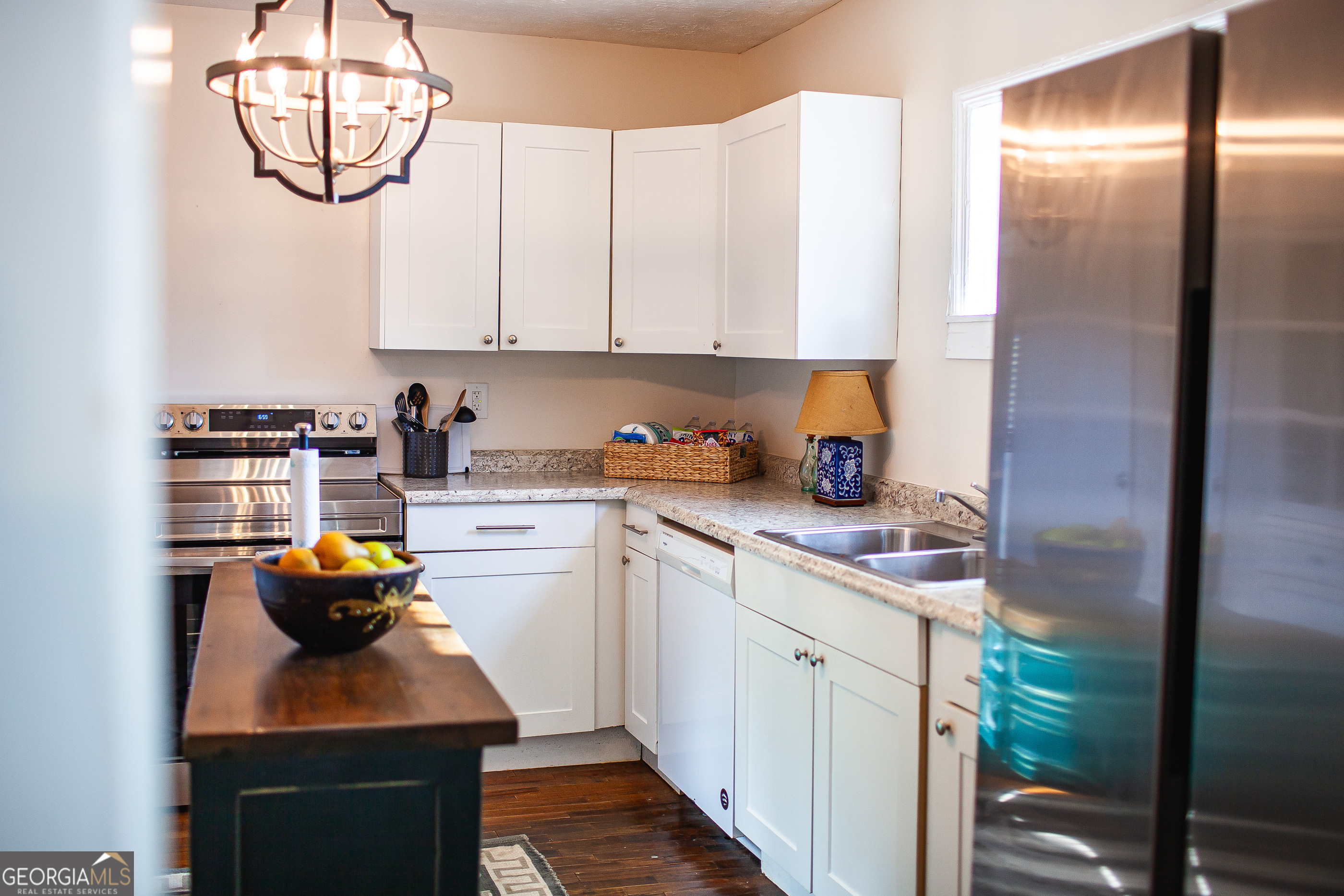 161 Calhoun Road Hamilton, GA 31811 - Photo 64 of 90 a kitchen with a sink cabinets and window