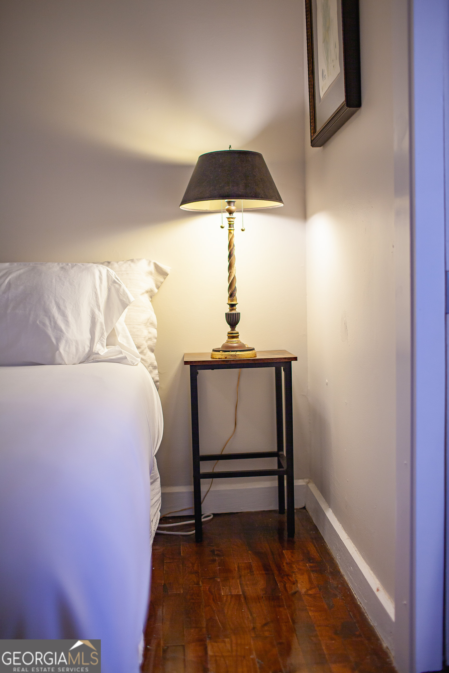 161 Calhoun Road Hamilton, GA 31811 - Photo 74 of 90 a bed sitting in a bedroom next to a window