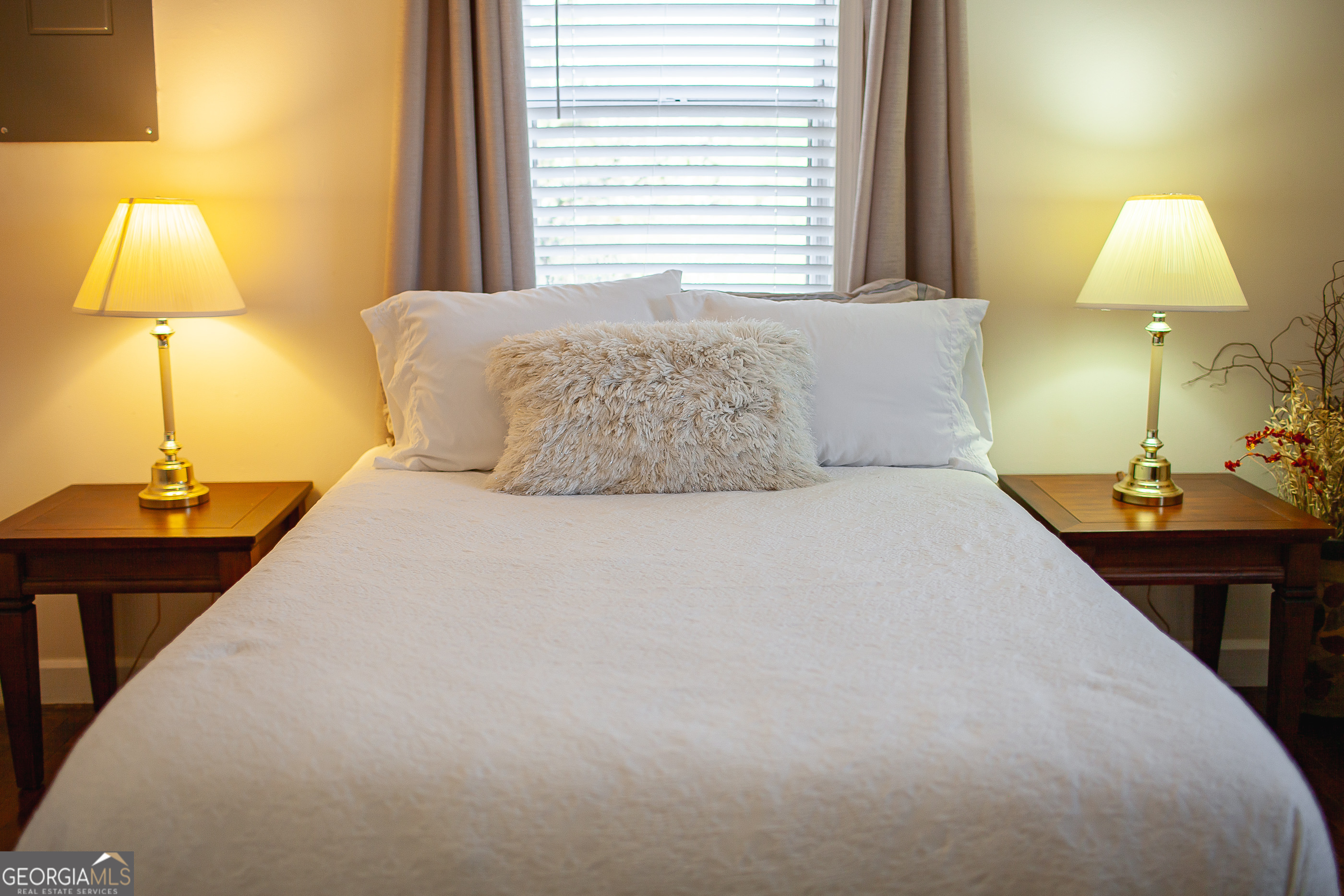 161 Calhoun Road Hamilton, GA 31811 - Photo 78 of 90 a bedroom with a bed and a lamp