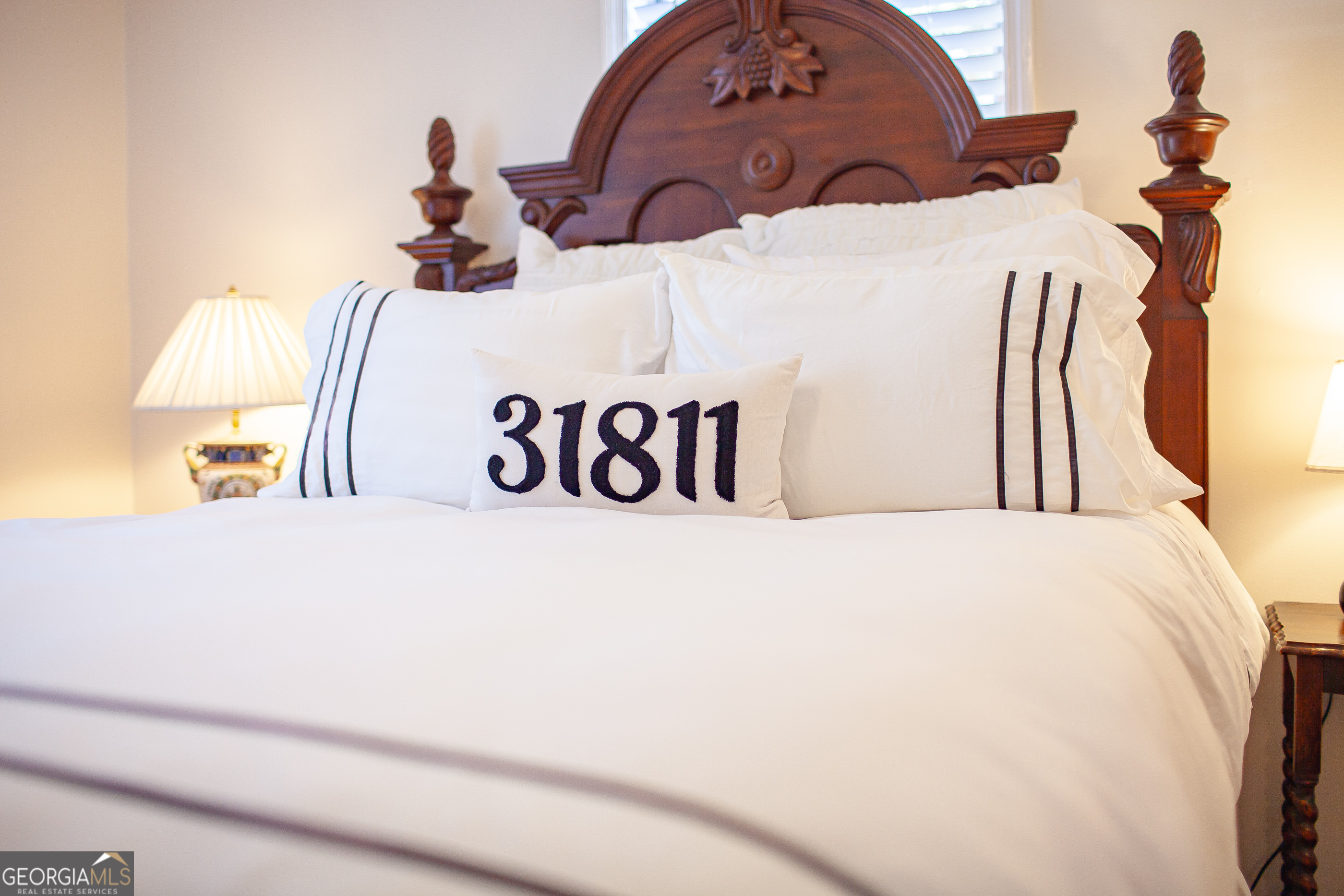 161 Calhoun Road Hamilton, GA 31811 - Photo 84 of 90 a bedroom with a bed and a painting on the wall