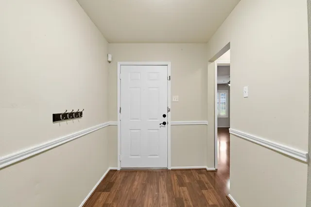 a living room with furniture ceiling fan and a window