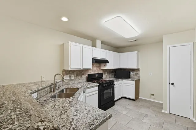 a bed room with a bed and a television