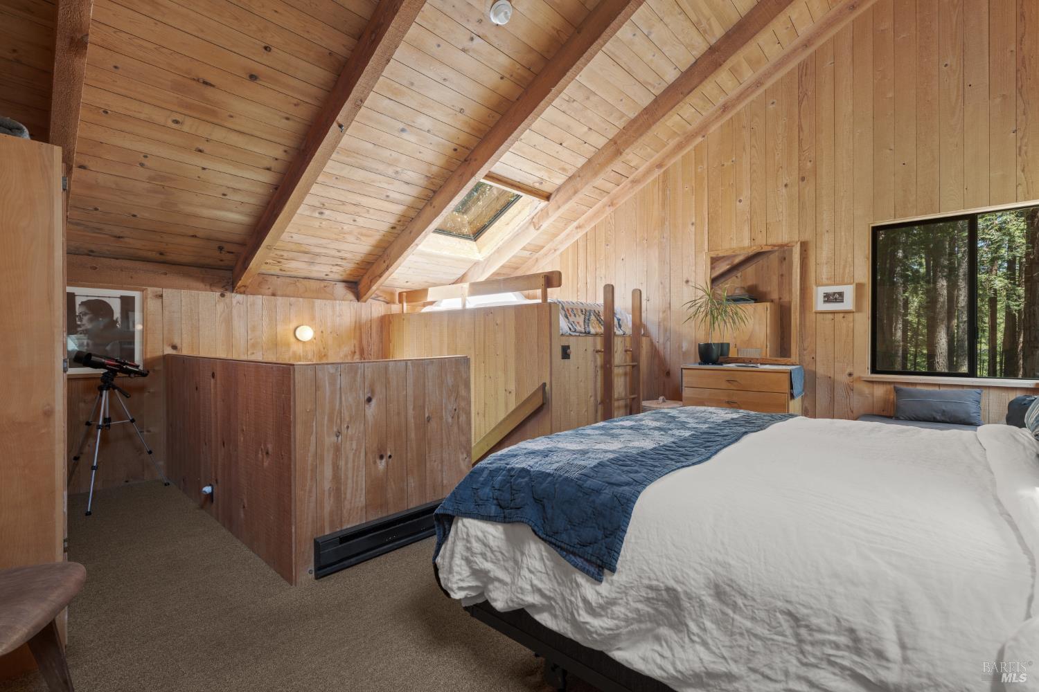 36778 Timber Ridge Road The Sea Ranch, CA 95497 - Photo 32 of 44 a spacious bedroom with a bed and a large window