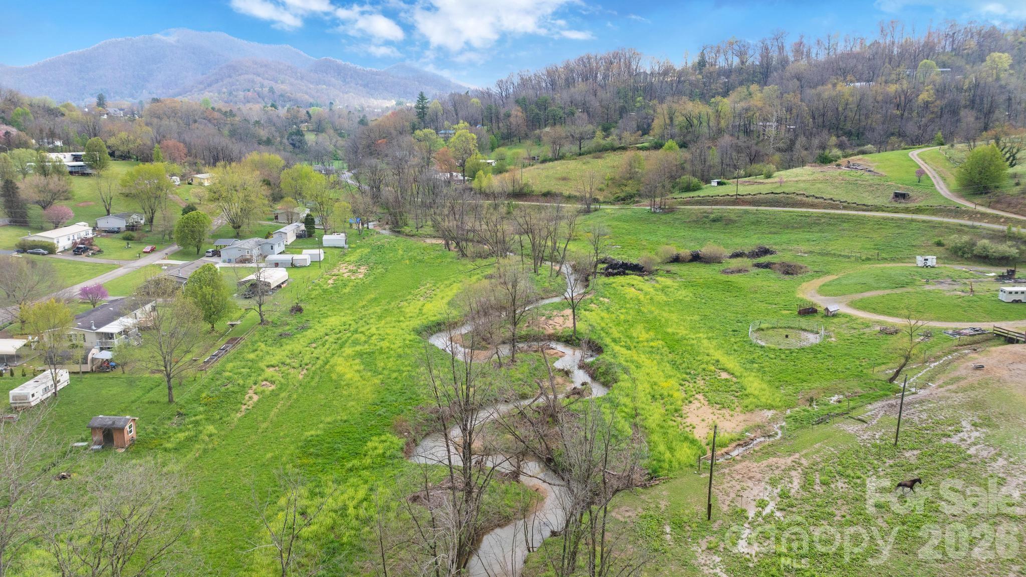 618 Beaverdam Street Canton, NC 28716 - Photo 4 of 21 a view of a city with lush green forest