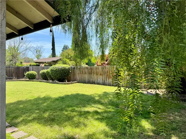 a backyard of a house with lots of green space