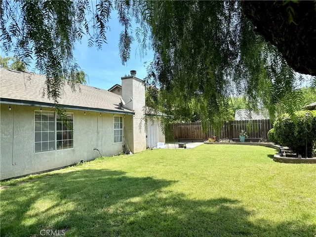 a view of a backyard with a small cabin