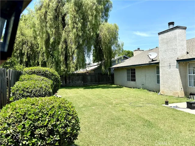 a view of a backyard of the house