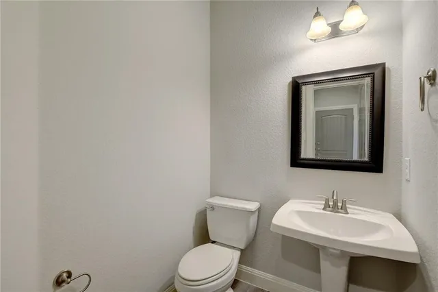 a backyard of a house with wooden fence