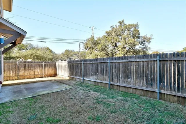 a view of a house with a yard and garage