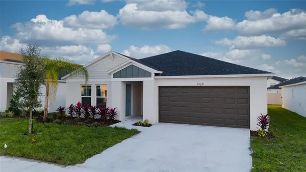a front view of a house with a garden and entertaining space