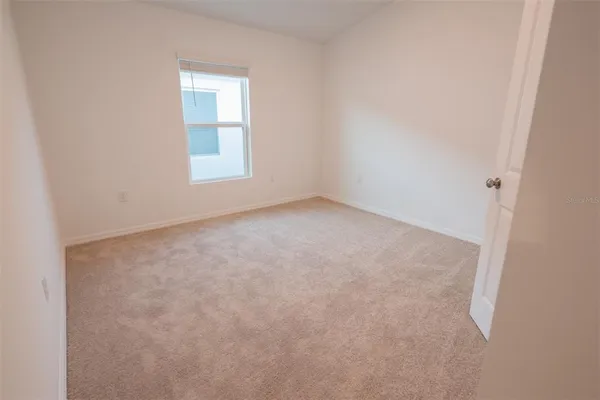 a spacious bathroom with a double vanity sink and mirror