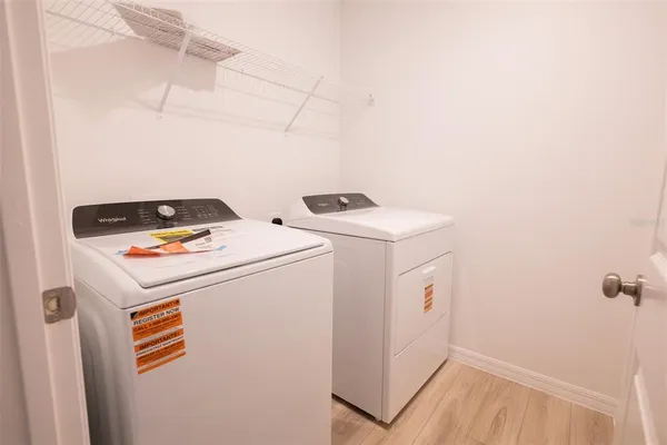 a kitchen with sink a microwave and refrigerator