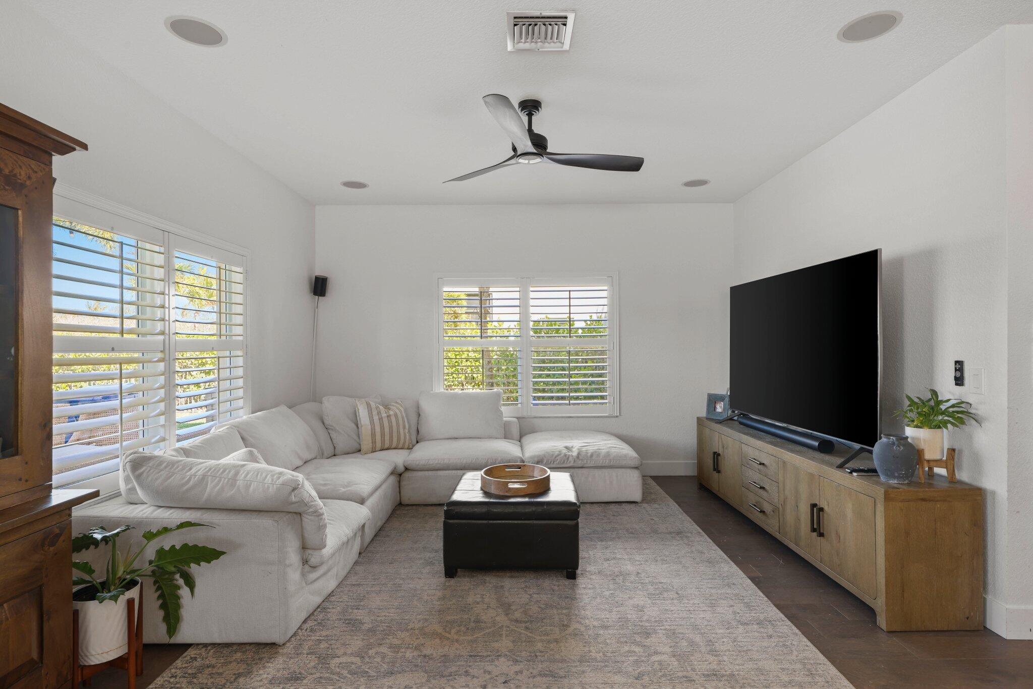168 Andros Harbour Place Jupiter, FL 33458 - Photo 12 of 71 a living room with furniture and a flat screen tv