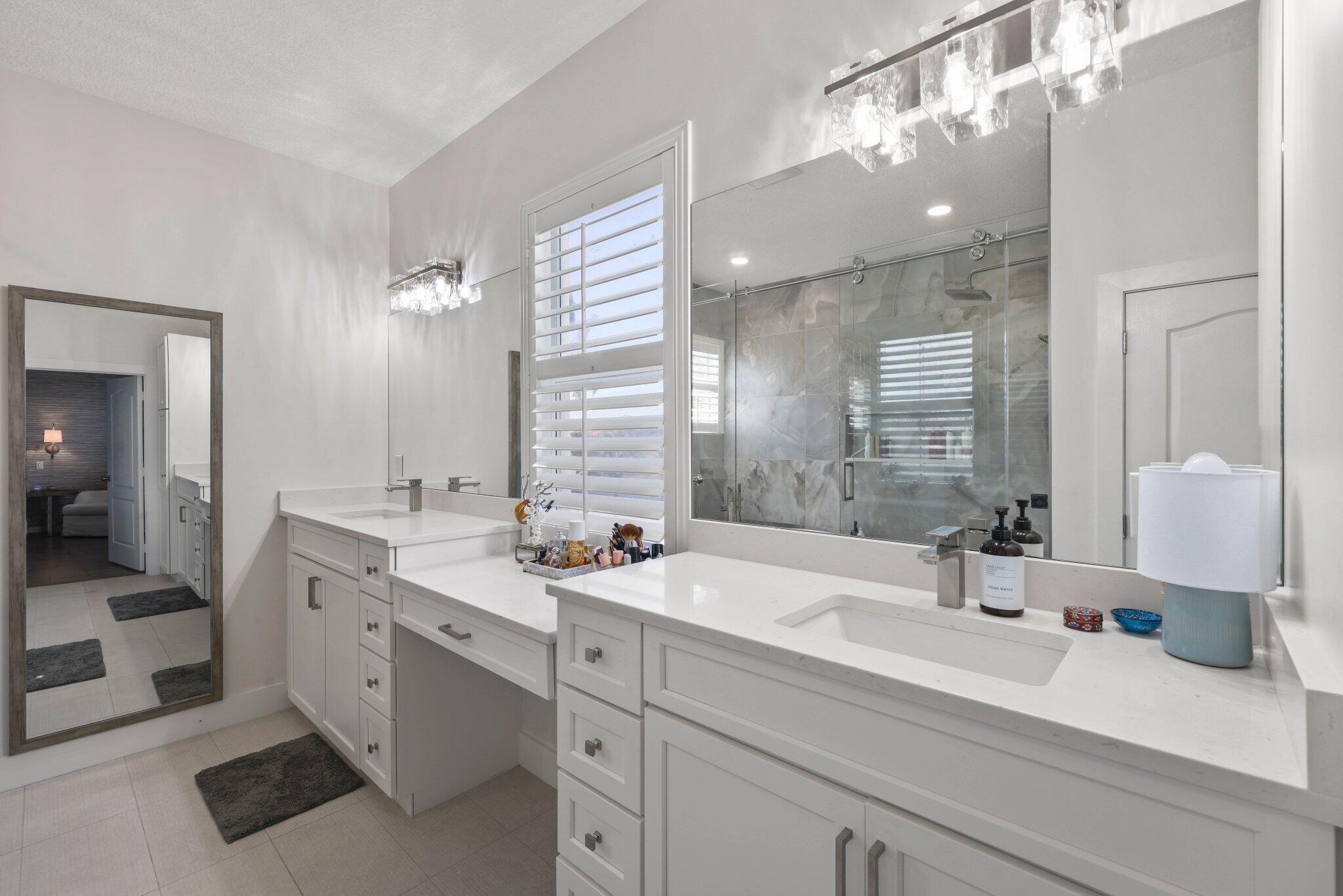 168 Andros Harbour Place Jupiter, FL 33458 - Photo 14 of 71 a bathroom with a double vanity sink mirror and shower