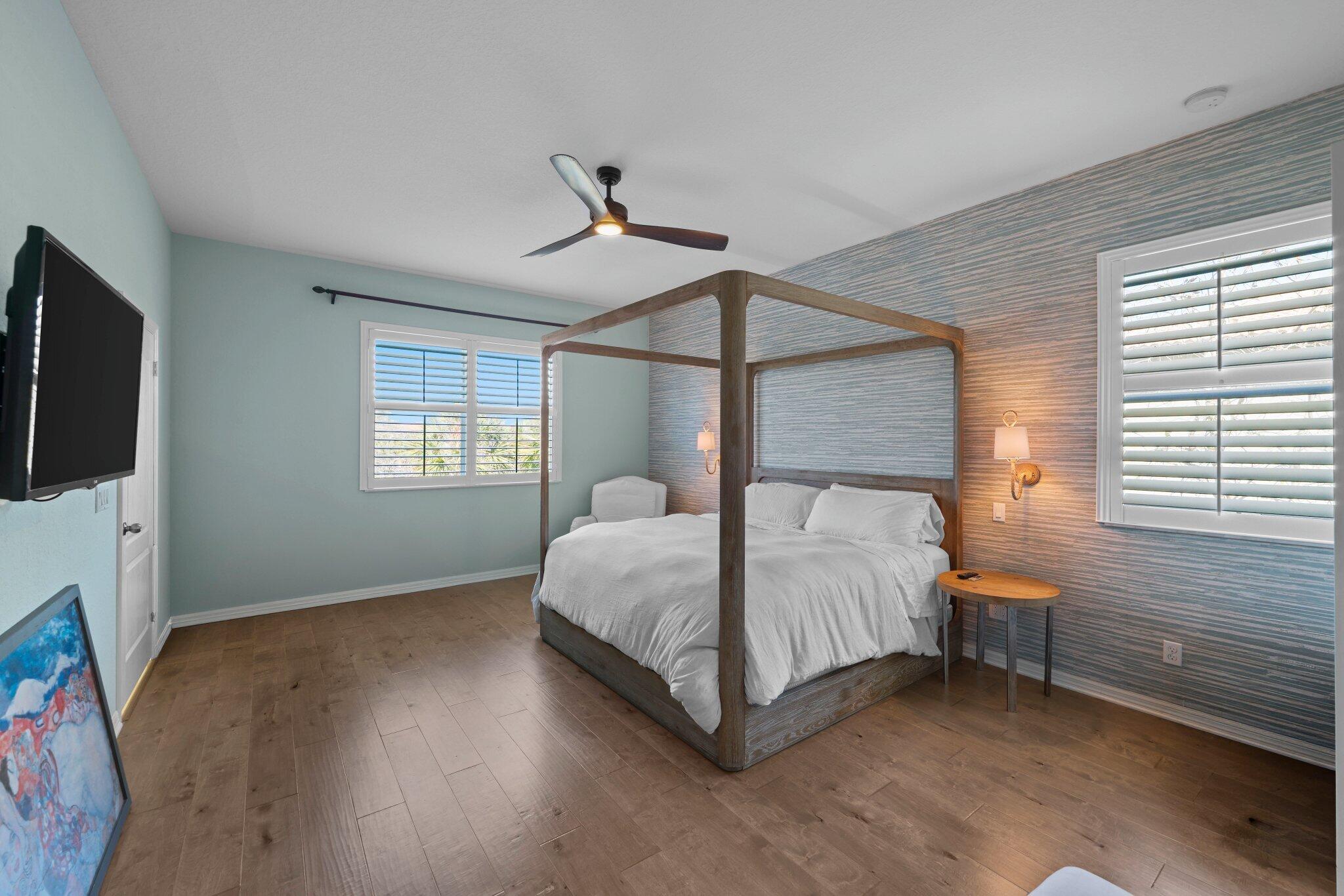 168 Andros Harbour Place Jupiter, FL 33458 - Photo 17 of 71 a bedroom with a bed and a flat screen tv
