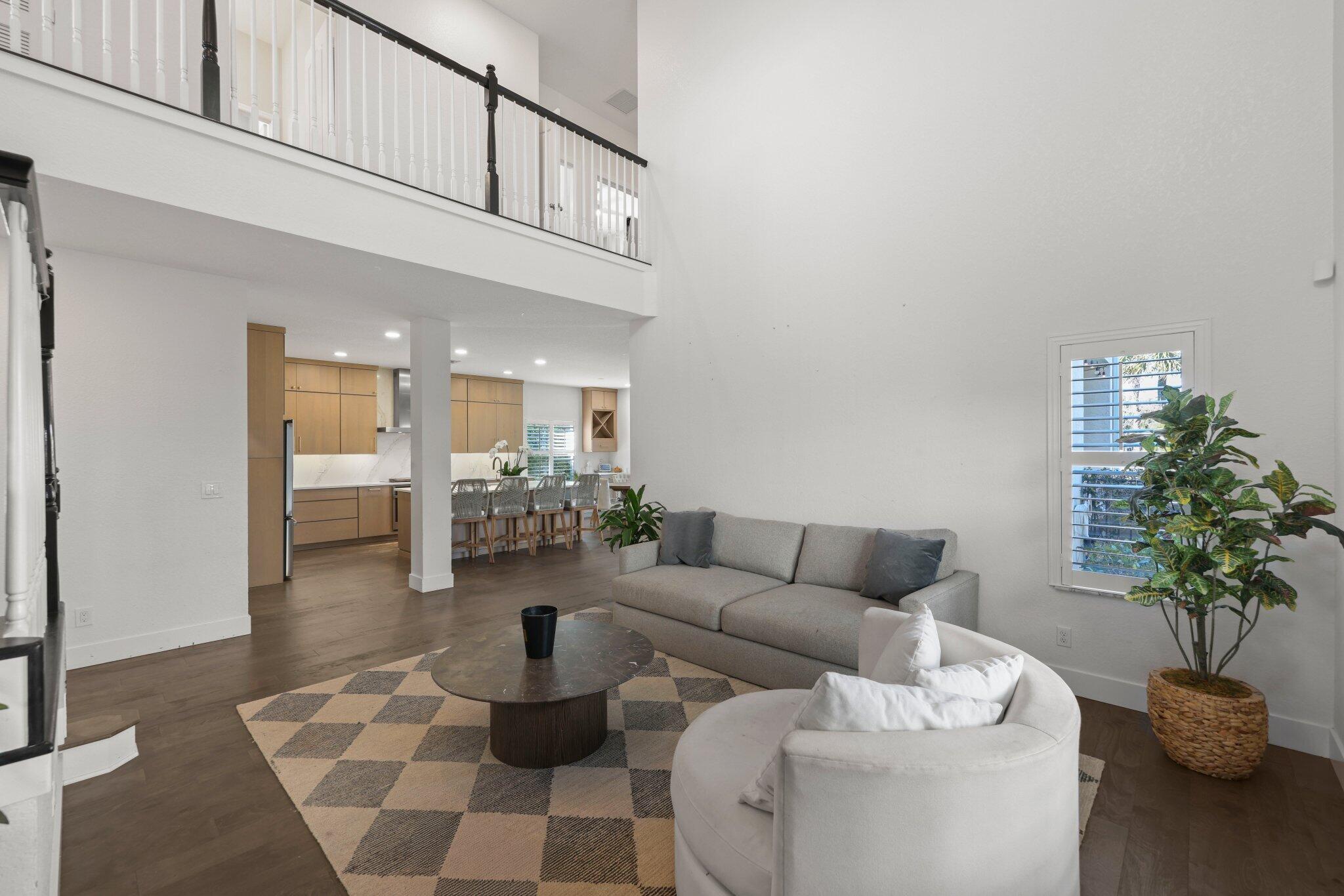 168 Andros Harbour Place Jupiter, FL 33458 - Photo 23 of 71 a living room with furniture and a potted plant
