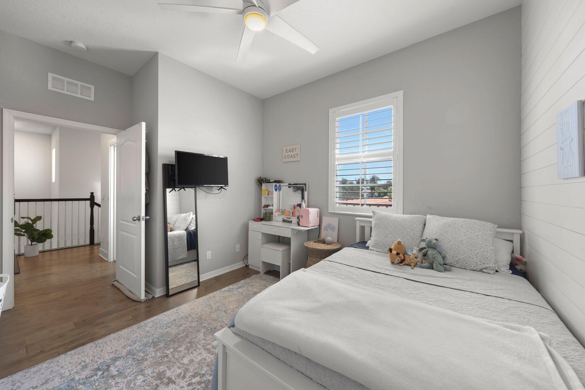 168 Andros Harbour Place Jupiter, FL 33458 - Photo 33 of 71 a bedroom with a bed and a tv