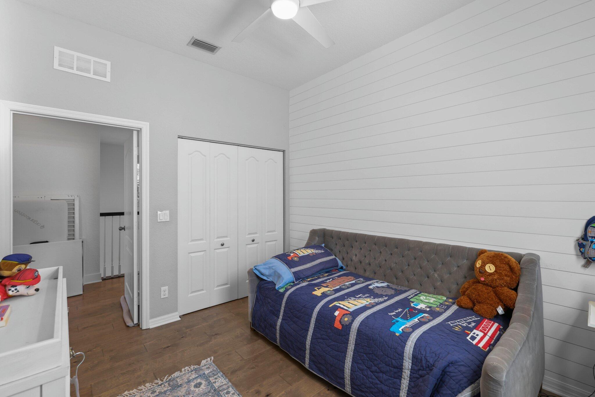 168 Andros Harbour Place Jupiter, FL 33458 - Photo 37 of 71 a bedroom with a bed and a chandelier fan