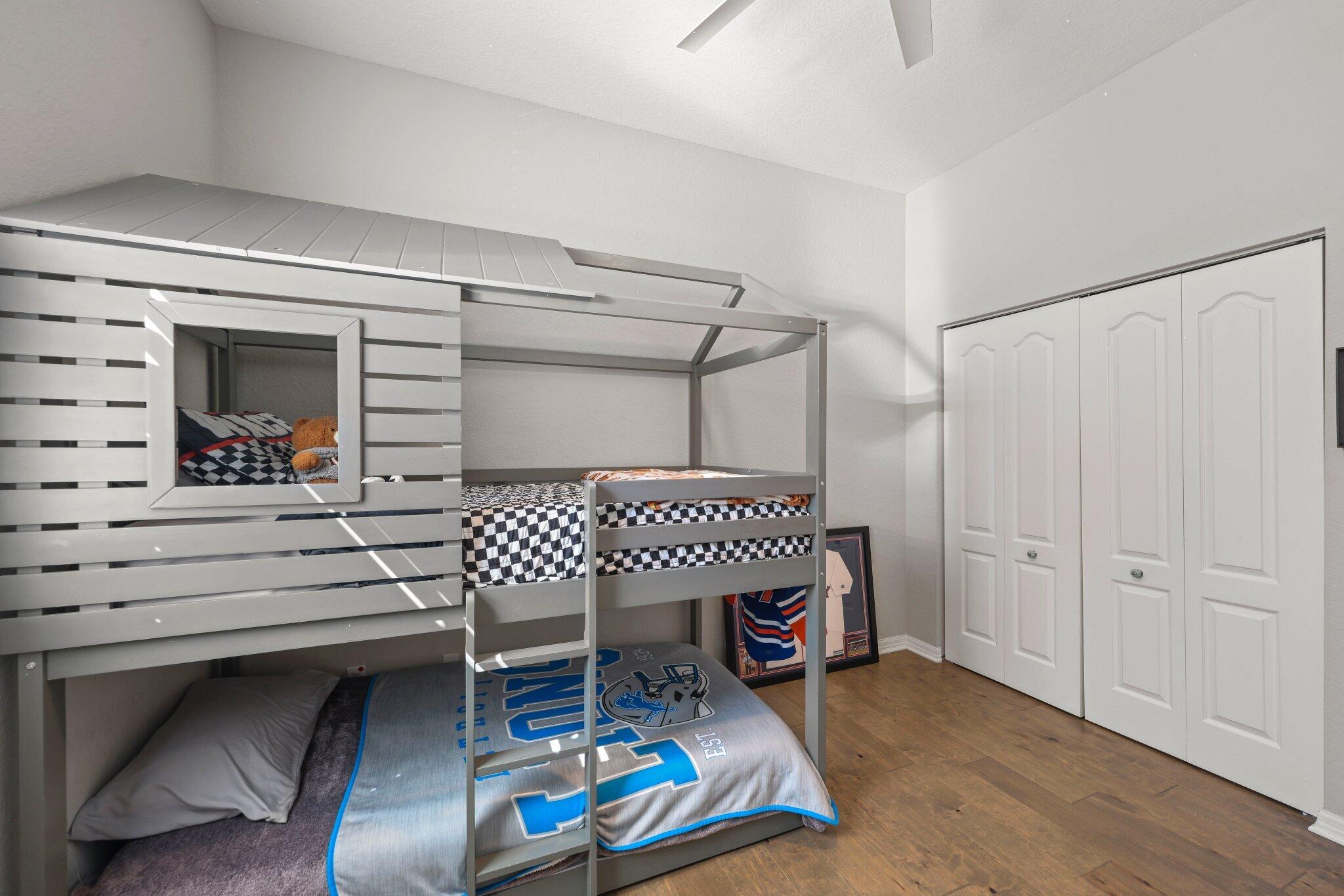 168 Andros Harbour Place Jupiter, FL 33458 - Photo 39 of 71 a bedroom with furniture and a fireplace