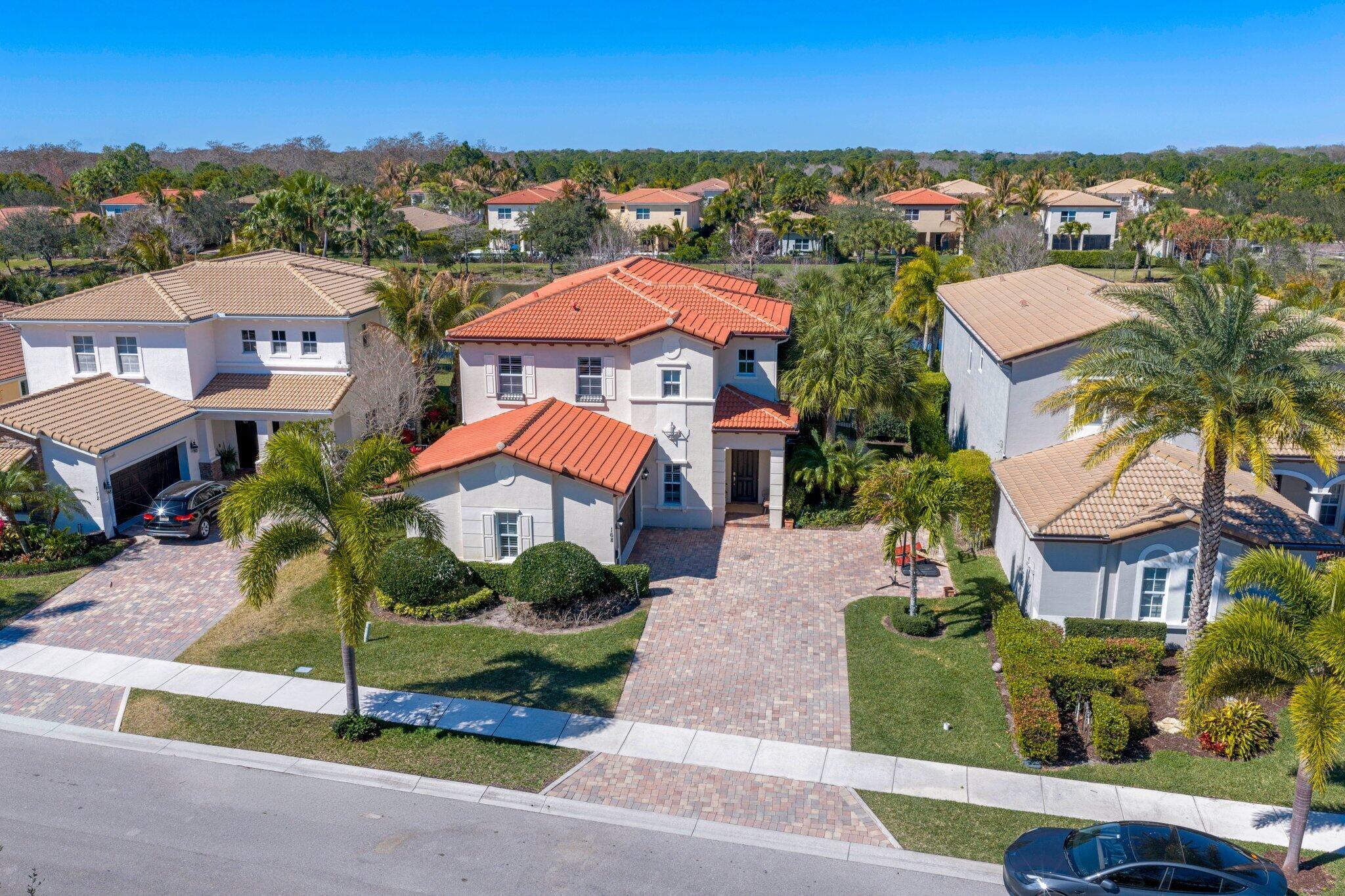 168 Andros Harbour Place Jupiter, FL 33458 - Photo 49 of 71 an aerial view of multiple houses with a yard