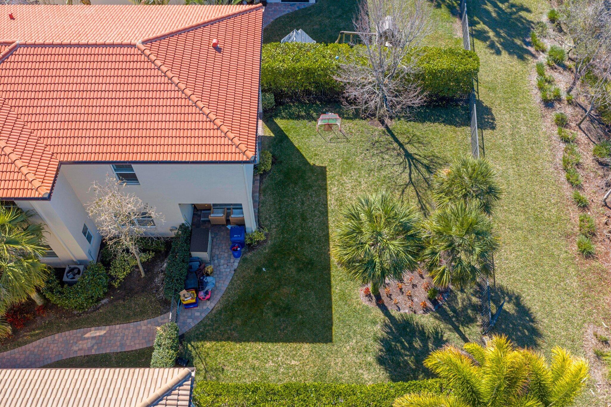 168 Andros Harbour Place Jupiter, FL 33458 - Photo 53 of 71 a view of a house with a yard