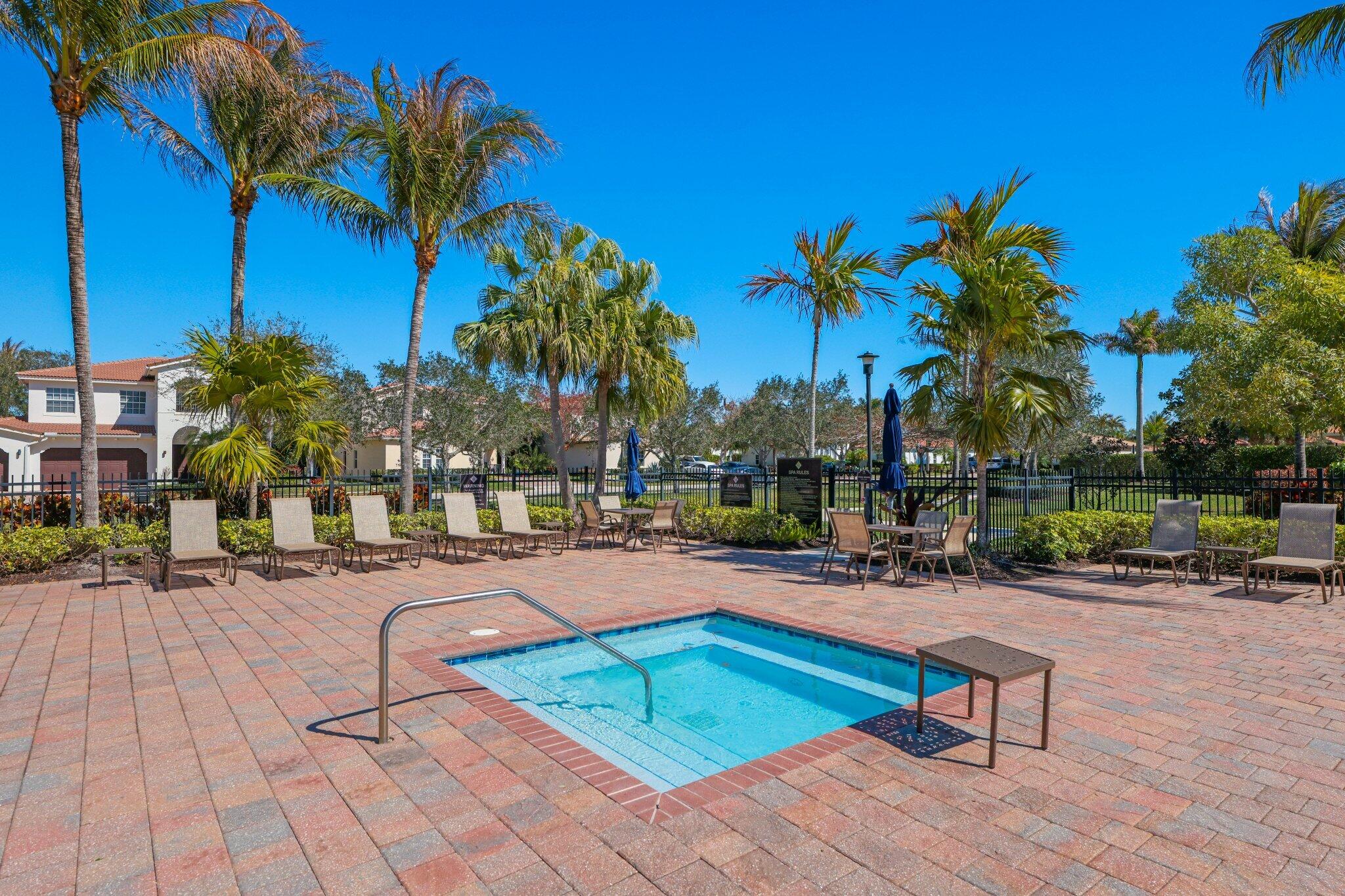 168 Andros Harbour Place Jupiter, FL 33458 - Photo 65 of 71 a view of a swimming pool with lounge chair