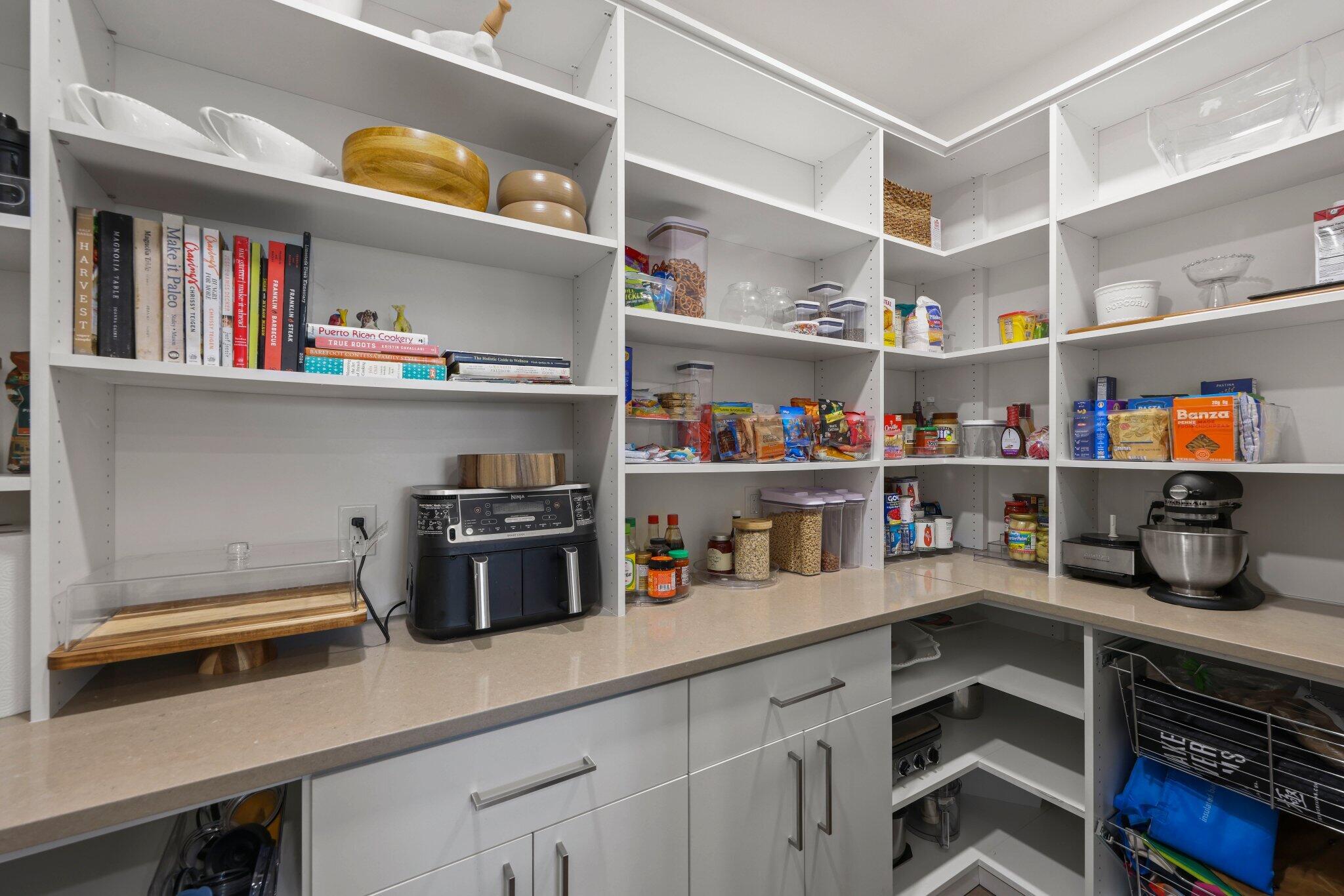 168 Andros Harbour Place Jupiter, FL 33458 - Photo 9 of 71 a kitchen with a refrigerator and a stove top oven