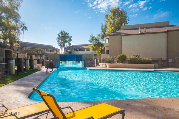 a view of a backyard with plants and a patio