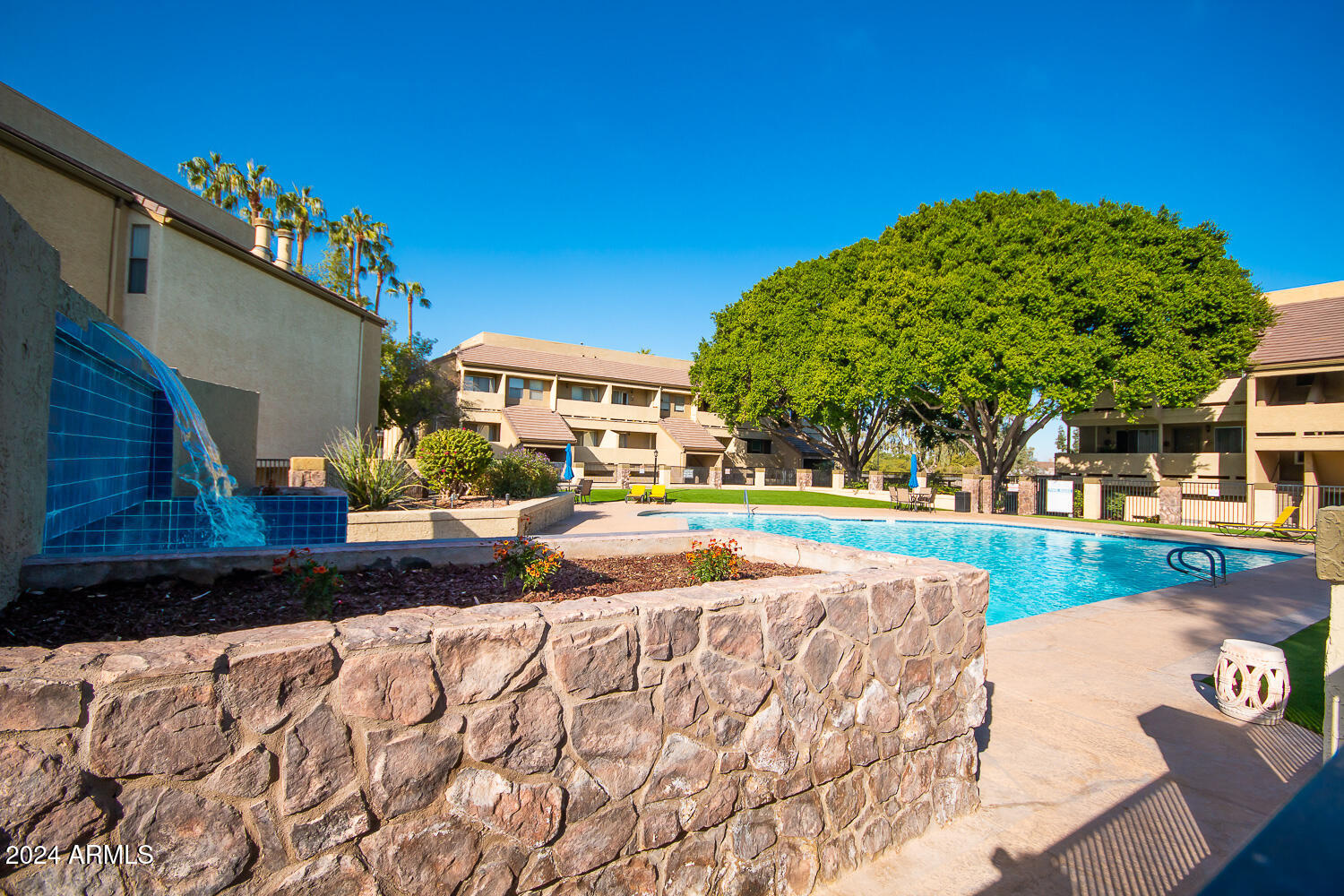 1331 West Baseline Road, Unit 253 Mesa, AZ 85202 - Photo 31 of 31 a view of swimming pool with outdoor seating and deck